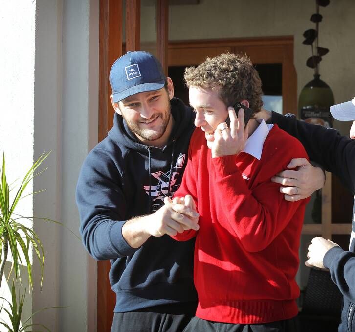 A cheeky Xavier Leslie couldn’t resist taking the photographer’s attention away from Brendan Fevola. Picture: TARA GOONAN