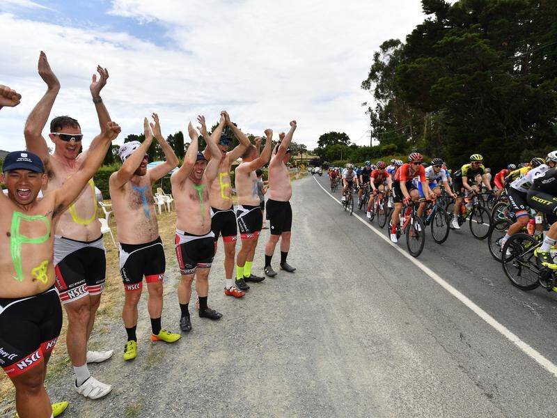 Supporters watch the peloton during another hot stage three of the Tour Down Under.
