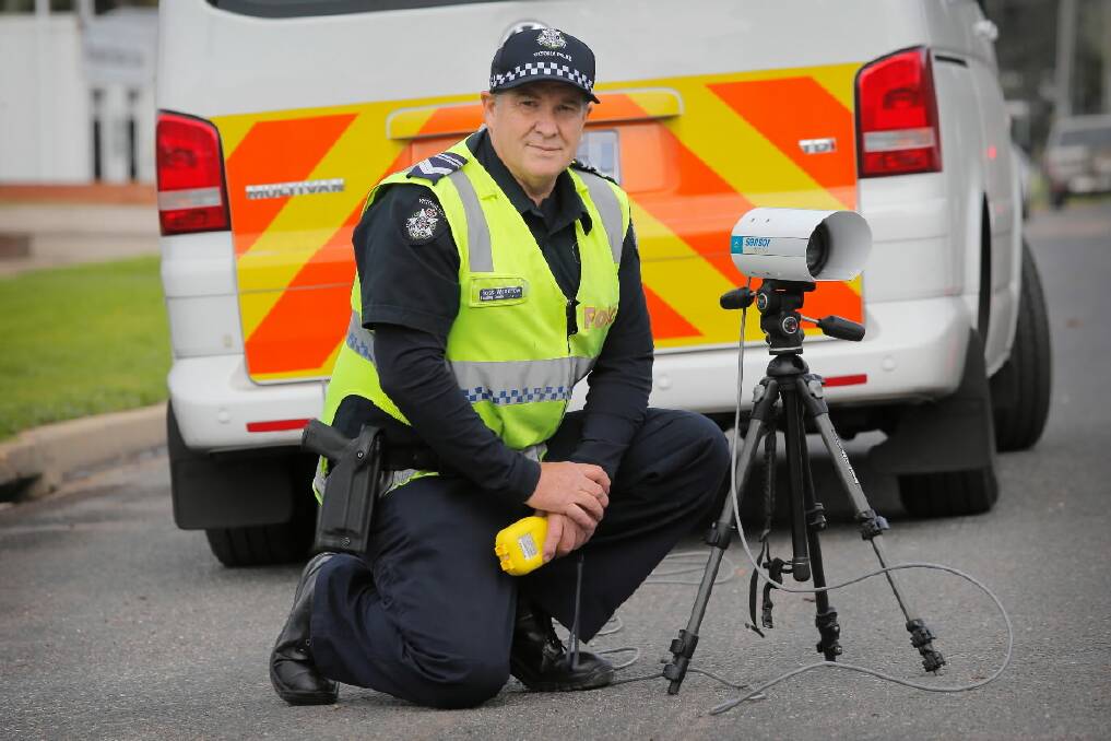 Leading Sen-Constable Ross Woodrow with the number plate scanning technology used during the checks. Picture: TARA GOONAN