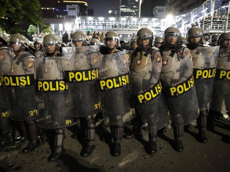 Protests in Jakarta turned violent late Tuesday and continued during the night.