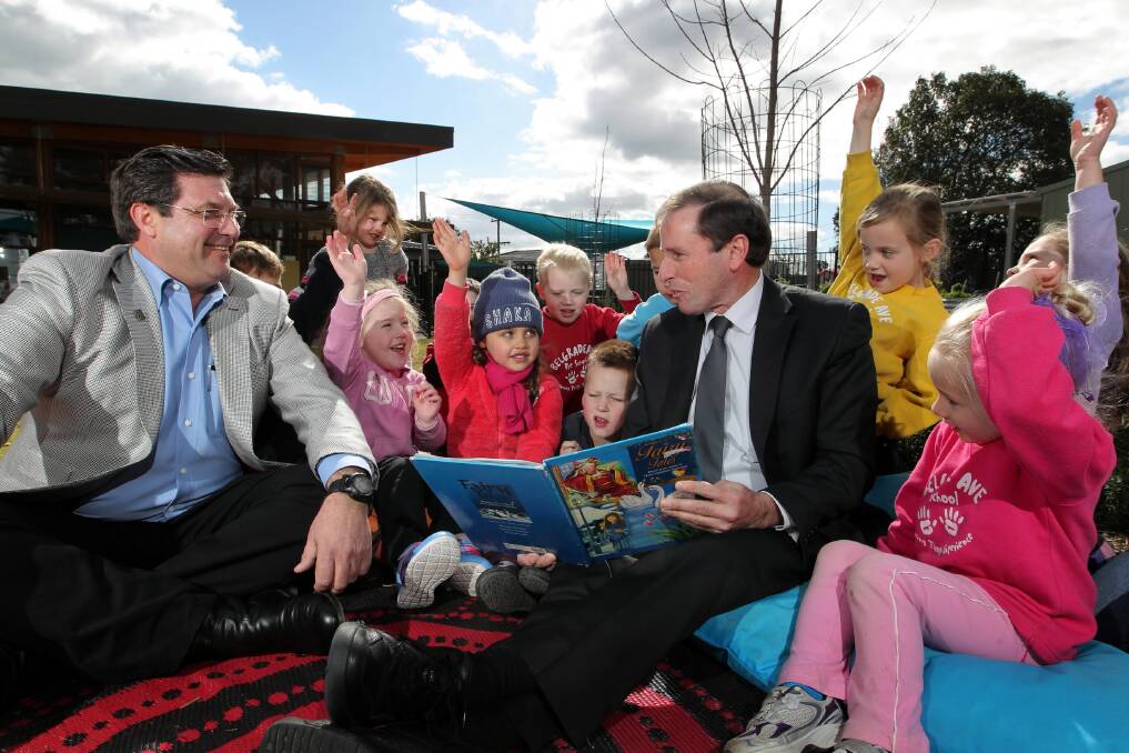 Bill Tilley and Rod Wangman with some of the children who will benefit from a funding boost they announced yesterday for the Access to Early Learning program. Picture: DAVID THORPE