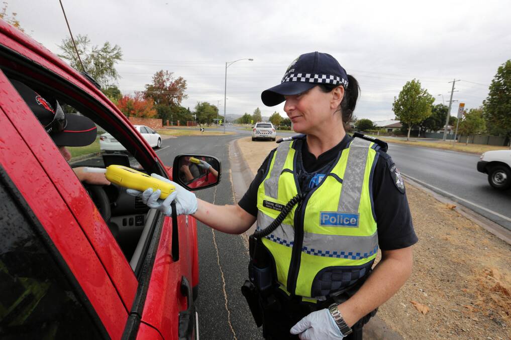 A driver is tested in Wodonga by Acting Sergeant Donna Allen yesterday. Picture: PETER MERKESTEYN