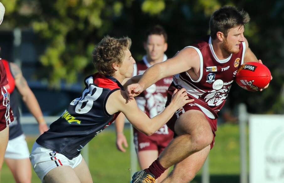 Wodonga's Ben Heinrich moves away from Zac Plemming with the footy. Pictures: TARA GOONAN