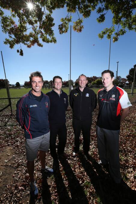 Wodonga Raiders president Nic Conway, AFL Victoria officials Grant Saunders and Glenn Finlayson and Wodonga Saints president Clayton Wood celebrate grants. Picture: MATTHEW SMITHWICK