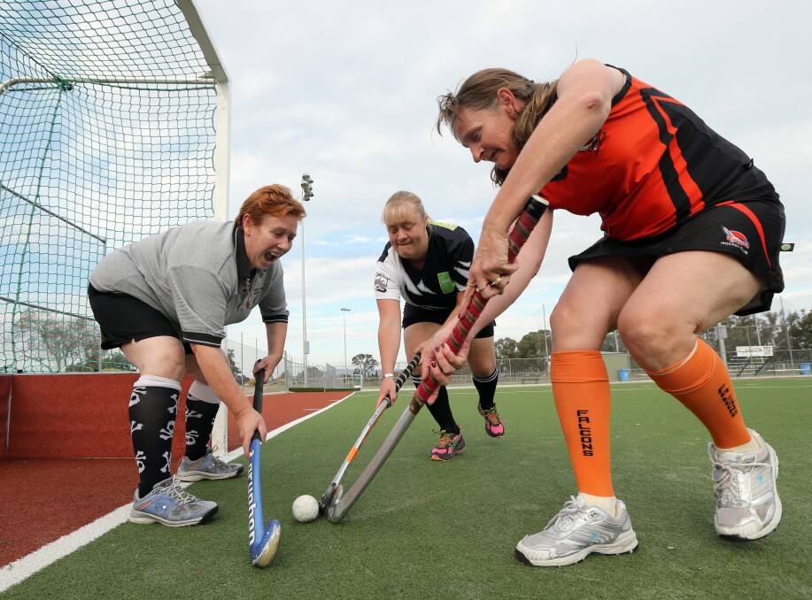 Joanne Duffy, Danielle Martin and Natasha Towne are part of a growing number of veteran hockey players returning to the pitch. Picture: PETER MERKESTEYN