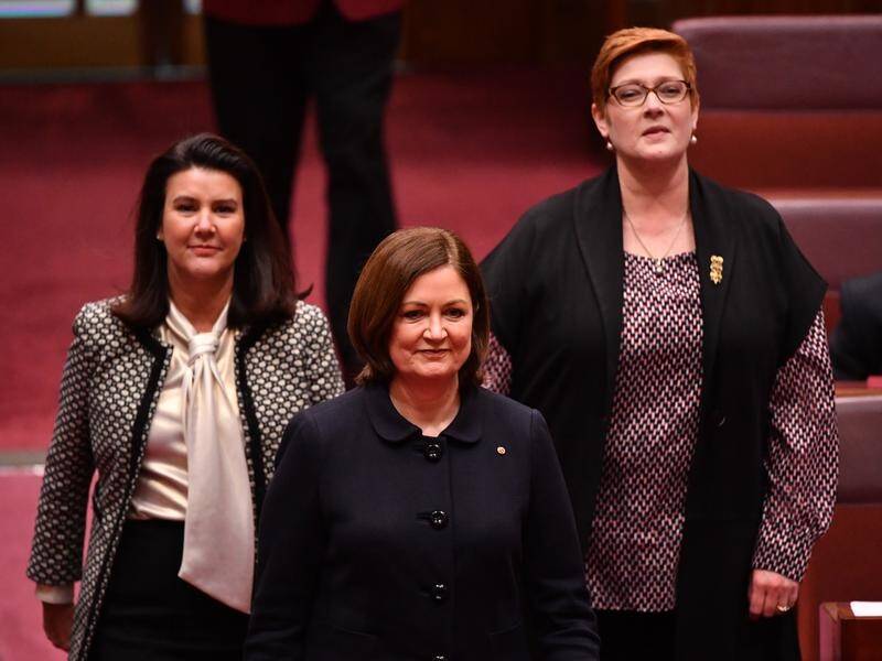 Senators Jane Hume (L) and Marise Payne (R) flanked Victorian Sarah Henderson as she was sworn in.