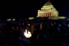 A large crowd gathered outside the Shrine of Remembrance in Melbourne in chilly temperatures. (Con Chronis/AAP PHOTOS)