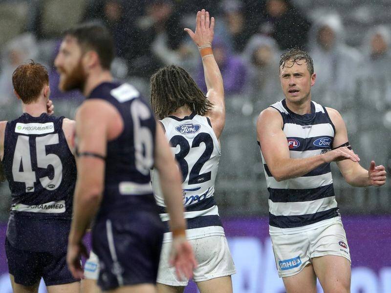 Mitch Duncan (r) prepares to celebrate his goal in Geelong's 32-point AFL win over Fremantle.
