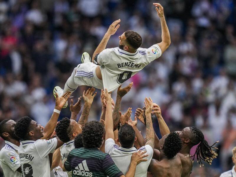 Karim Benzema was given the celebratory bumps by teammates after his final match for Real Madrid. (AP PHOTO)