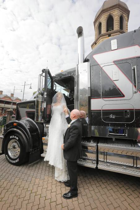 The soon-to-be Hayley Amarant, of Albury, is helped from her bridal truck by her father, Des Franks, of Kilmore, at St Patrick’s Church. Picture: TARA GOONAN