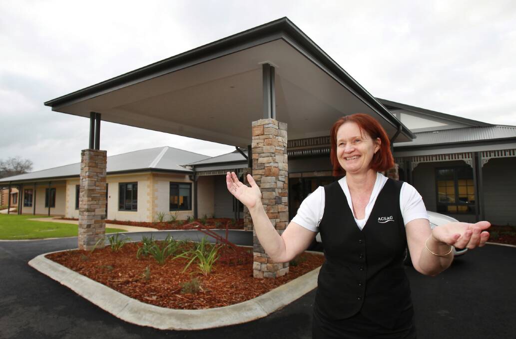 Albury and District Aged Care Residence manager Chris Cupitt shows off the entrance to the 90-room facility that replaces the Albury and District Private Nursing Home. Picture: KYLIE ESLER