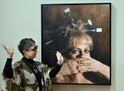 Jaq Grantford has won the Darling Portrait Prize with a painting of herself during COVID lockdown.