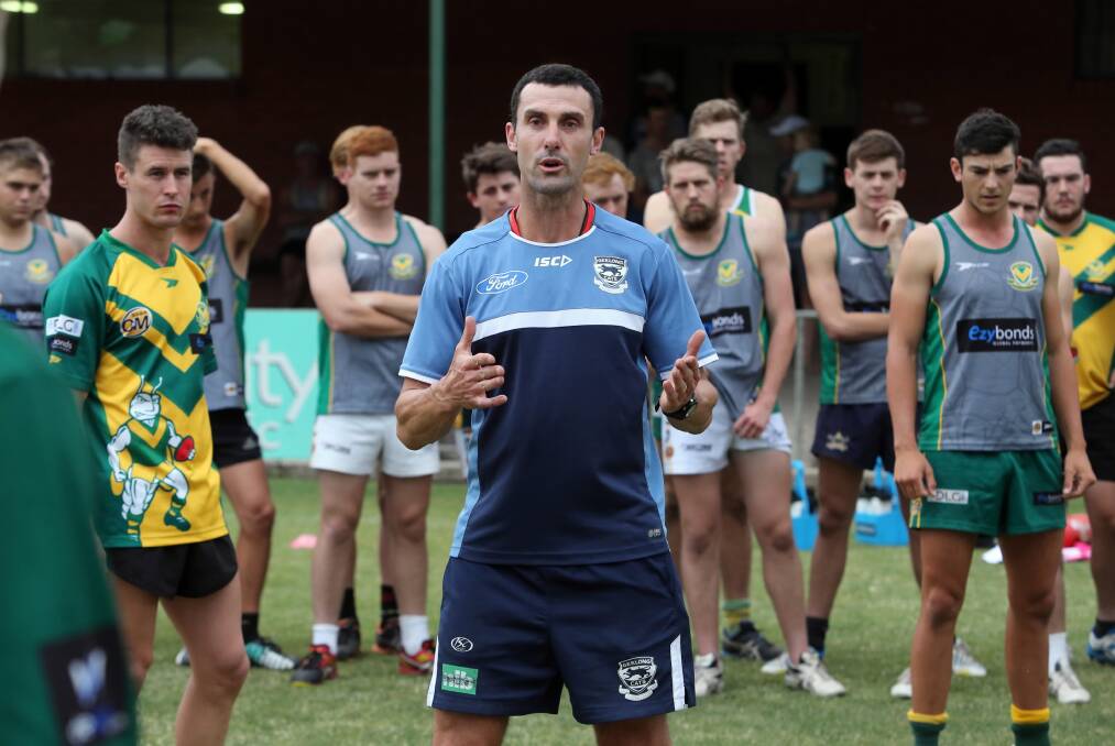 Nigel Lappin talks to the troops and shows them some playing techniques. Picture: PETER MERKESTYN