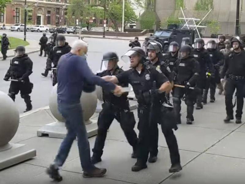 An image from video showing a riot officer shoving a 75-year-old protester in Buffalo, New York.