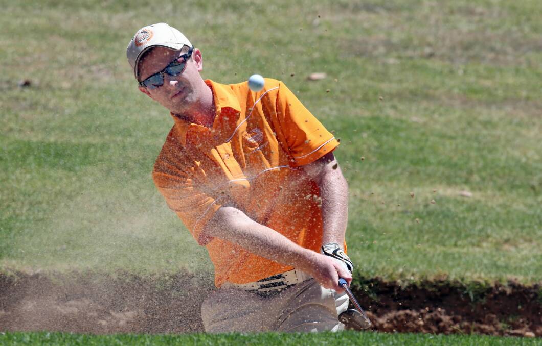 Thurgoona’s John Barfoot explodes from the bunker on his way to a 4/2 win over Nathan Boehm. Picture: PETER MERKESTEYN