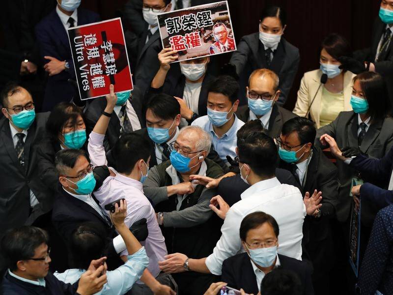 Pan-democratic and pro-Beijing legislators have scuffled in the colony's legislature.