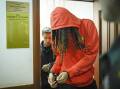 WNBA star and Olympic gold medallist Brittney Griner leaves court after a hearing.