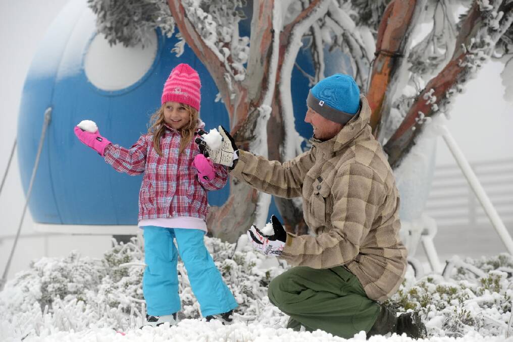 Tamiko Rey, 7, from the Philippines, enjoys the snow at Falls Creek yesterday. Pictures: CHRIS HOCKING