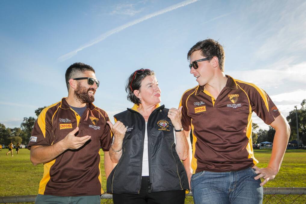 Cathy McGowan speaks to Kiewa’s Nat Sarinan and Brad Freak about the budget at Barnawartha. Picture: DYLAN ROBINSON