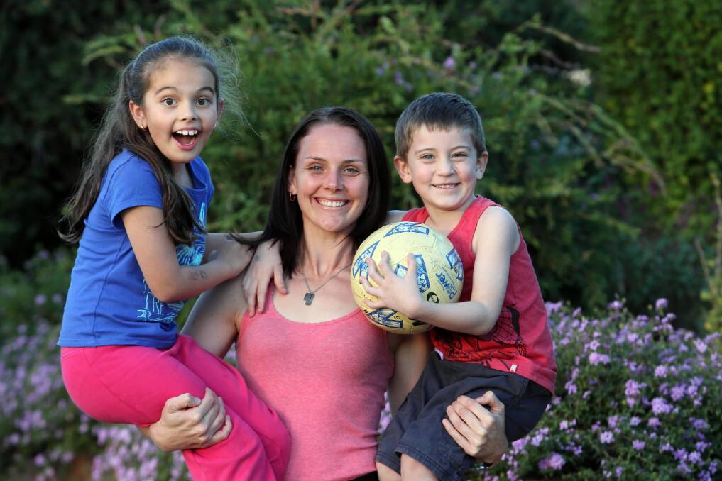 Beth Kennedy and her children Harmony, 7, and Levi Reeves, 4, ahead of her representative comeback on Friday. Picture: PETER MERKESTEYN