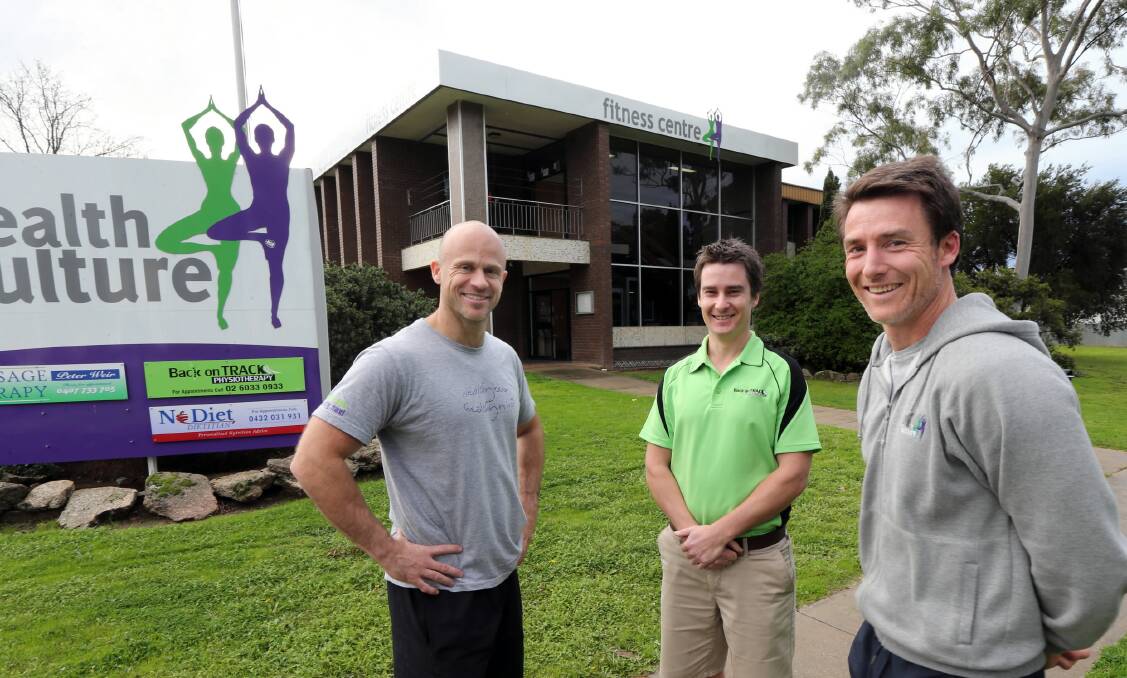 Getting Corowa physical and in top health are Jamie Almond, physiotherapist Jeremy Carr and Darrell Spencer. Mr Almond and Mr Spencer have taken over the old Corowa Shire offices and will now use it as a health centre. Picture: PETER MERKESTEYN