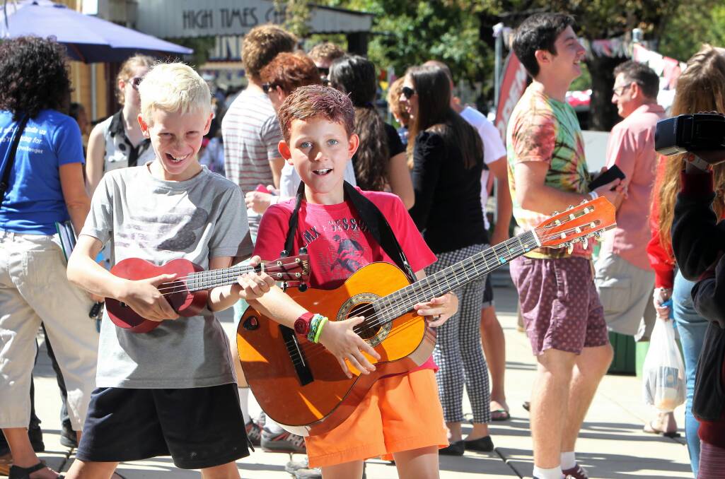 Isaac Jansen, 10, and Maccie Vonthien, 9, show visitors how Yackandandah children really love their music. Pictures: KYLIE ESLER 