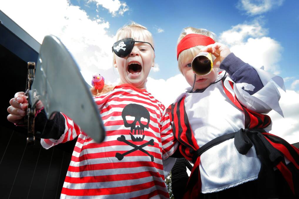 Elka Graham and Reuben Case give their best pirate impressions at yesterday’s Pirates on the Grass event in Wodonga. Picture: TARA GOONAN