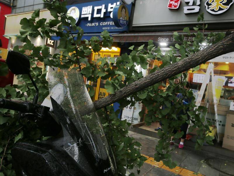 A typhoon has hit South Korea and North Korea, causing widespread damage and killing eight people.