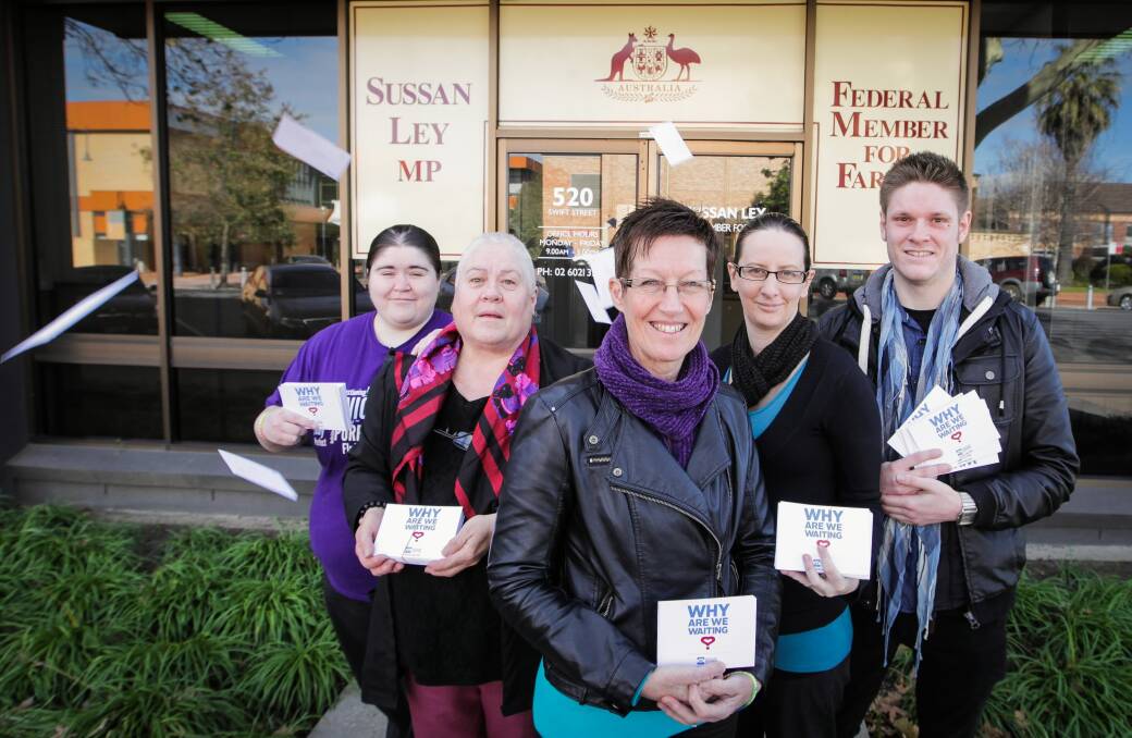 Meghan Hall, Marie Hall, Toni Johnson, Cathy Prior and Mark Green from Hume Phoenix with marriage equality post cards they delivered to MP Sussan Ley’s office yesterday. Picture: DYLAN ROBINSON
