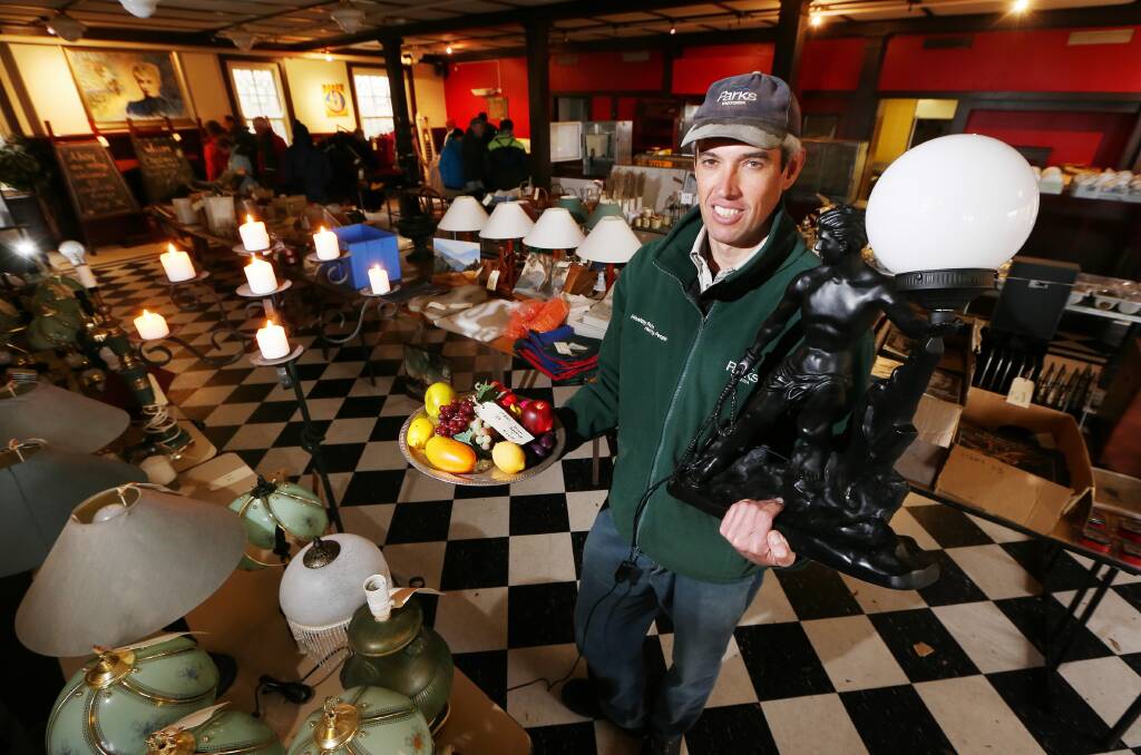 Julien Atherstone with some of the items to be sold. Picture: JOHN RUSSELL