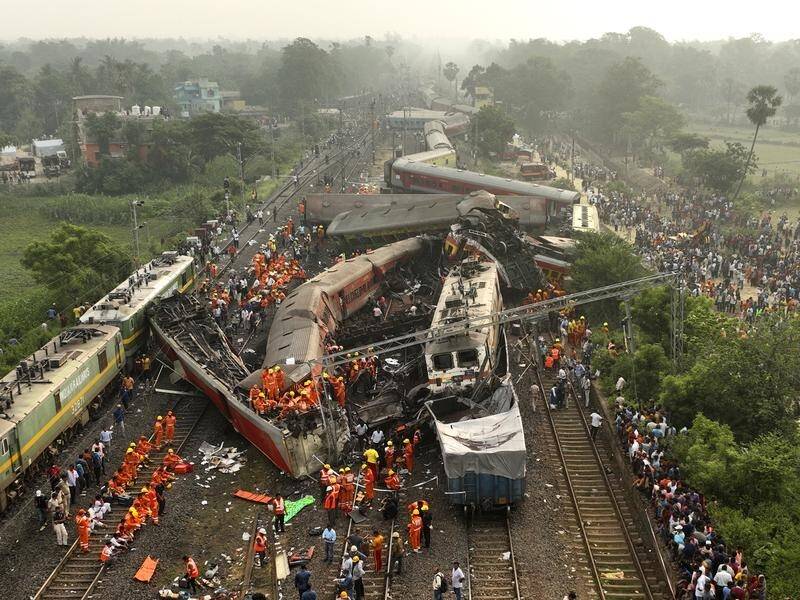 At least 275 people were killed when a passenger train went off the tracks and hit another in India. (AP PHOTO)