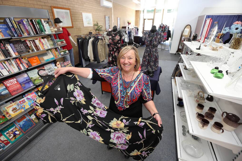 Elaine Hill gets the shop ready for Monday’s opening. Picture: PETER MERKESTEYN