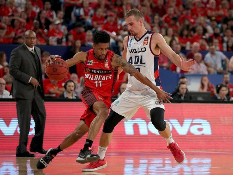 Bryce Cotton (left) finished with 29 points as the Wildcats surged to victory over Adelaide 36ers.