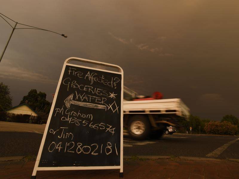 Rain is expected to help slow bushfires burning in areas across Victoria on Tuesday.