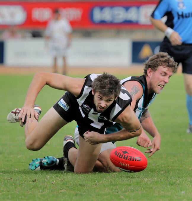 Magpies player Jesse Johnston and CDHBU player Sam Burdon fight for the ball. Picture: DAVID THORPE