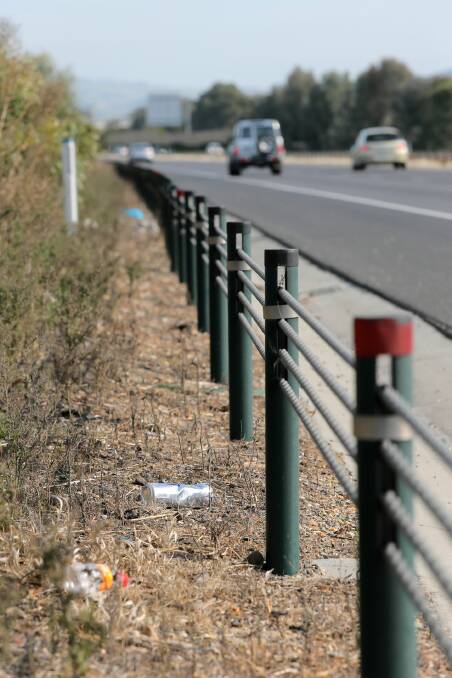 Rubbish frequently builds up behind the fences on the Albury-Wodonga Hume Freeway, leading the authorities to step up collections to six times a year. Picture: TARA GOONAN
