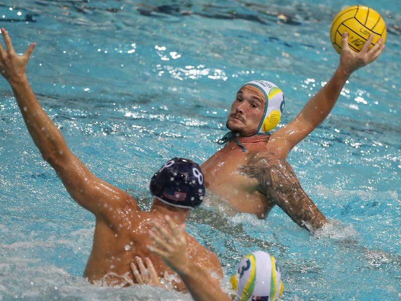 Aaron Younger of Australia with the ball during the water polo match against the US in Brisbane.
