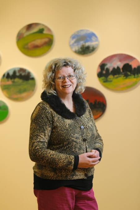 Mary-Jane Griggs checks her new exhibition entitled Elsewhere. Picture: TARA GOONAN