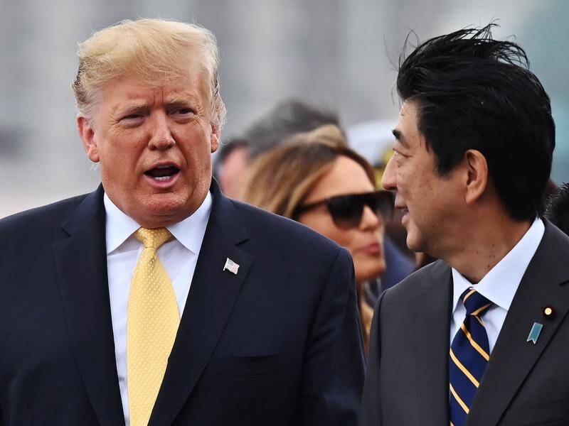 US President Donald Trump and Japan's Prime Minister Shinzo Abe after visiting a Japanese destroyer.