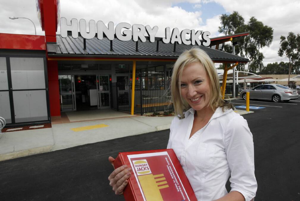 Toni Collins, pictured in 2009, in front of her new Hungry Jacks at Wangaratta.