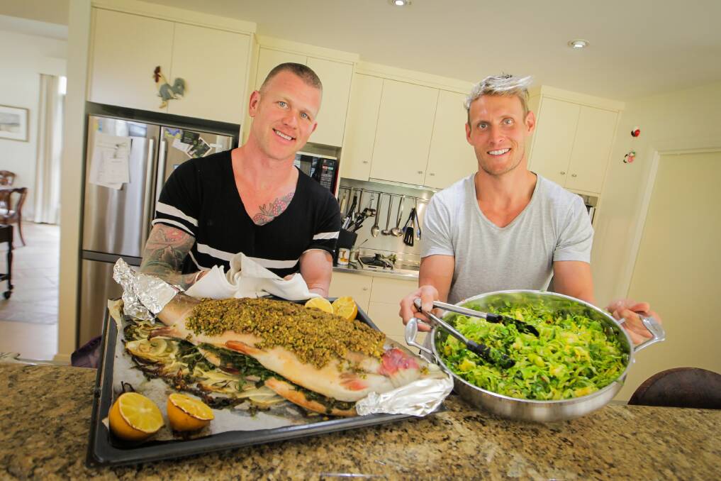 Lunch is served by Scott Gooding and Luke Hines at Splitters Creek yesterday. Picture: DYLAN ROBINSON