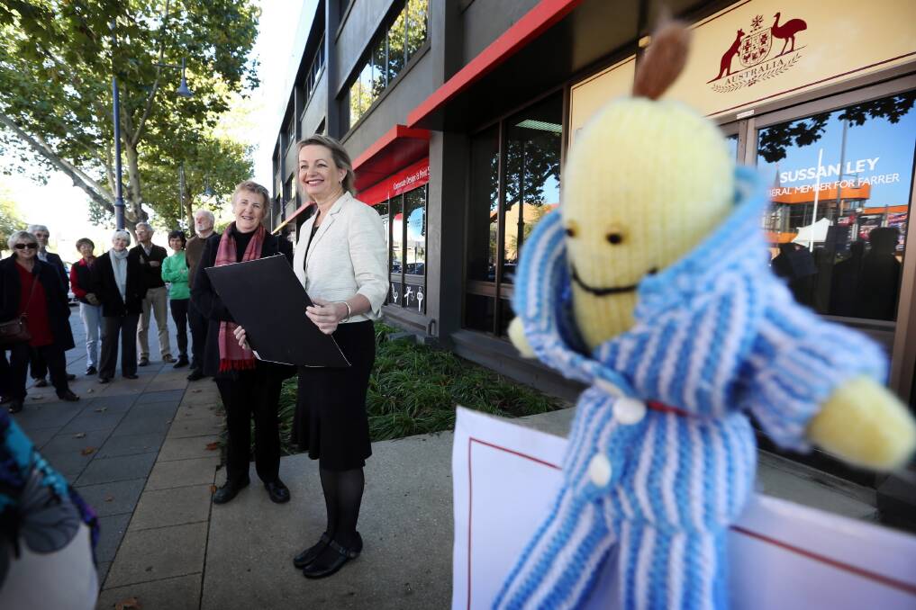 ABC supporters, with their Banana in Pyjamas mascot, outside Sussan Ley’s office yesterday. Picture: MATTHEW SMITHWICK