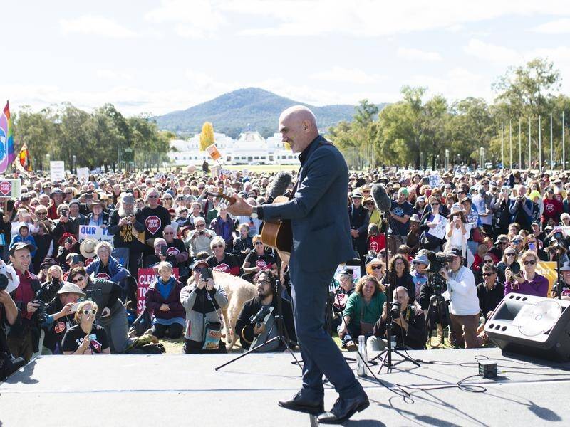 Paul Kelly performed at an anti-Adani rally outside Parliament House in Canberra.