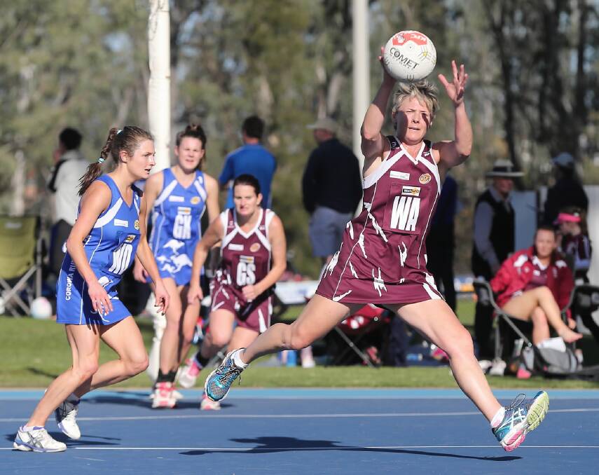 Wodonga’s Liona Edwards bursts clear of Corowa-Rutherglen’s Ruby Svarc to receive a pass. Pictures: JOHN RUSSELL