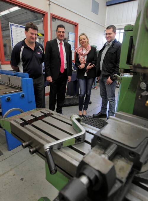 LEFT: Gavin Demarinis (Watters Electircal), Tim Farrah, assistant education minister Sussan Ley and Cameron Hawke (DTD Engineering) discuss the hurdles of border red tape when hiring  apprentices with the. Picture: DAVID THORPE