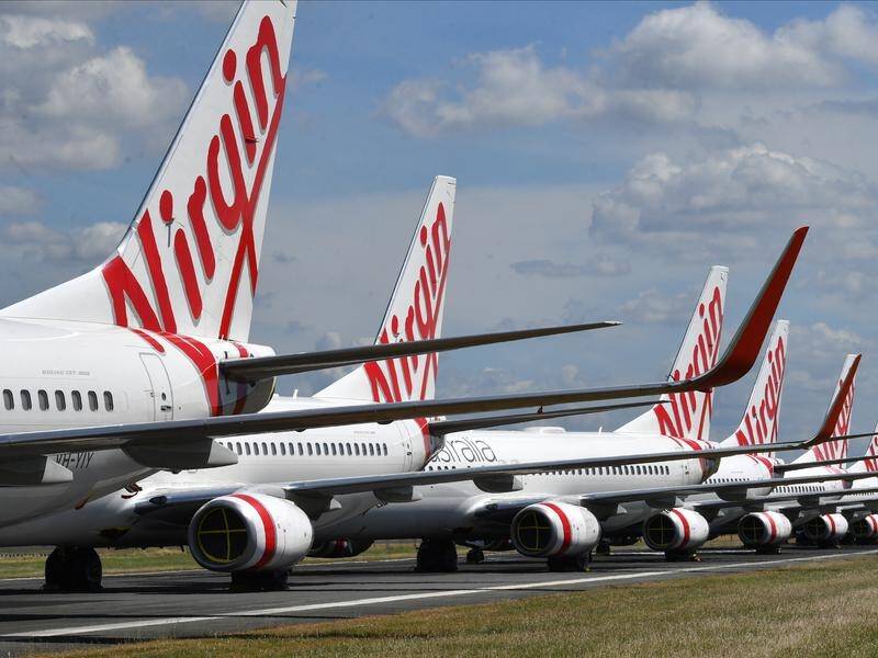 Queensland is eyeing a stake in Virgin Australia to keep its HQ in Brisbane and save local jobs.