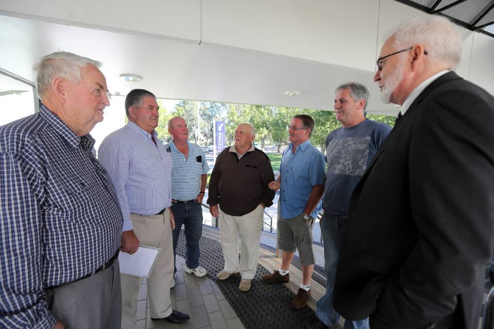 Former councillor Paul Talbot confers with Robert Purtle, Ray Hynes, Keith Brown, Bob Kay, Noel Wright and Michael Mullarvey. Pictures: PETER MERKESTEYN