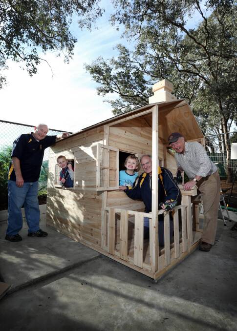 Peter Lee, Ryan Globen, 5, Perry Sullivan, 4, Dennis Martin and Ian Harrison at the Albury West Preschool cubby. It needs a lick of paint and should be finished next month. Picture: MATTHEW SMITHWICK
