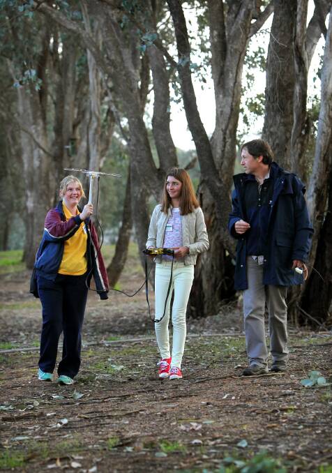 James Fallon High School student Kaitlin Scott, 15, and Finley High’s Jade O’Bryan, 14, learn about following animals through radio tracking from Charles Sturt University’s Matthew Hunt. Picture: MATTHEW SMITHWICK
