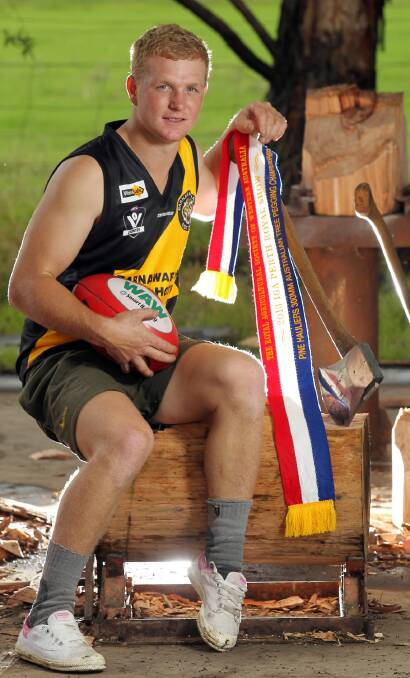 Best of both worlds ... Jarrod Williams juggles woodchopping and footy commitments at Barnawartha.